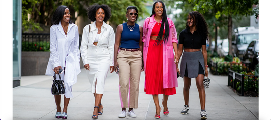 Corporate Fashionistas walking on the sidewalk